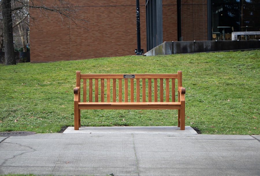 Empty wooden park bench on a quiet path