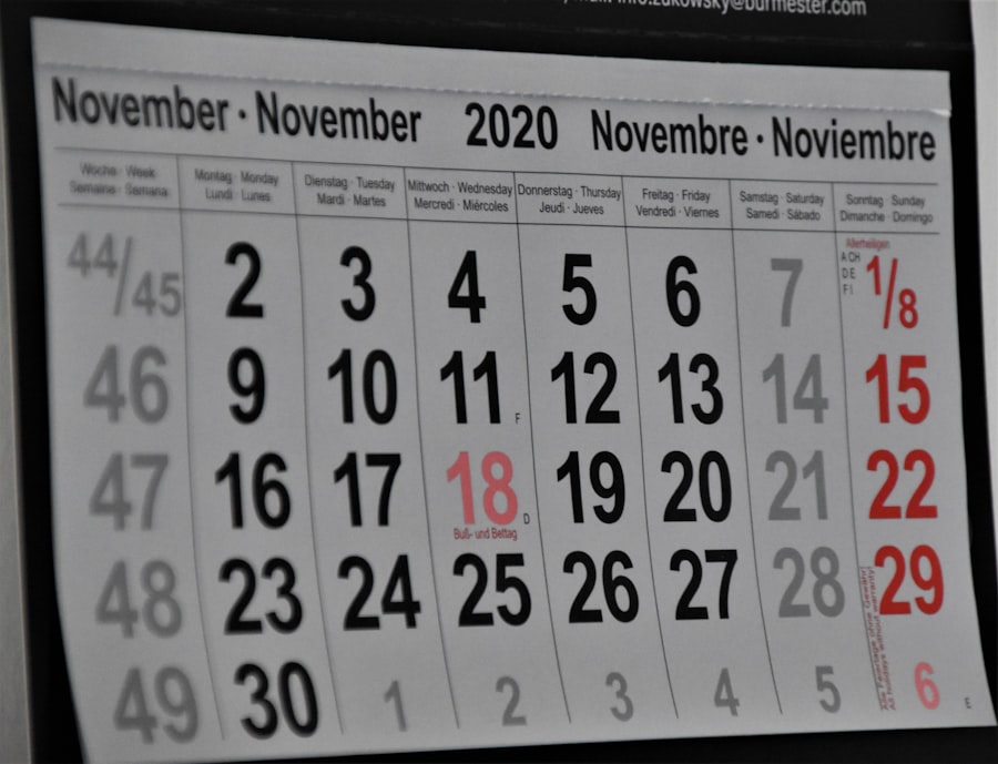 Wall calendar on a desk beside a monitor